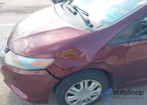 2011 Honda Insight from USA, damaged, VIN JHMZE2H37BS012364